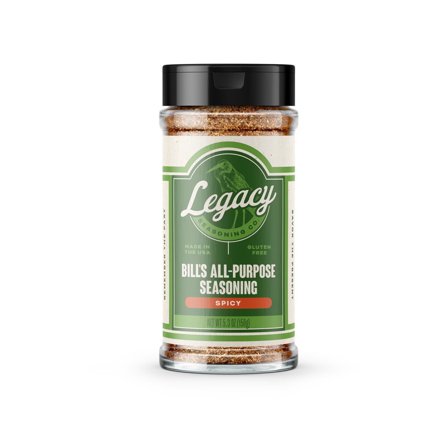 Shaker of Bill’s All-Purpose Seasoning: Spicy. The label features the company logo on a green background, with a light green drawing of a bird behind the logo.