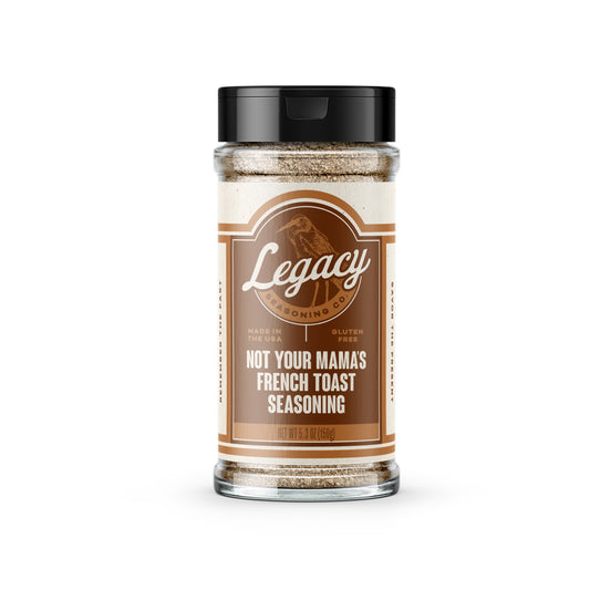 Shaker of Not Your Mama's French Toast Seasoning. The label features the company logo on a brown background, with a light drawing of a bird behind the logo.