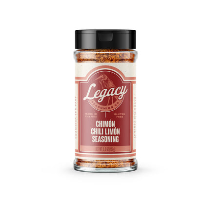 Shaker of Chimón Chili Limón Seasoning. The label features the company logo on a red background, with a pink drawing of a bird behind the logo.